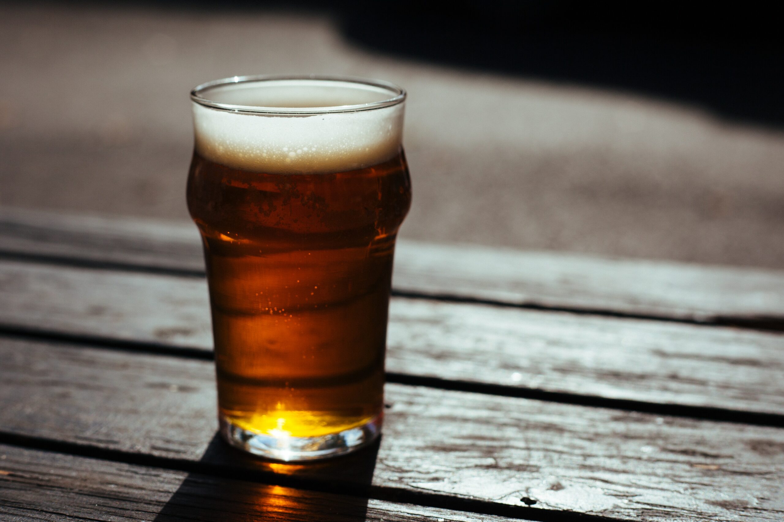 Glass of beer on table