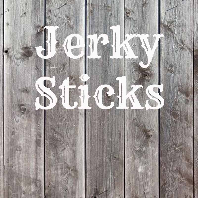 The word jerky sticks on a faded wood background